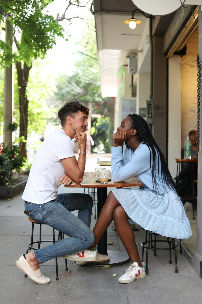 Man and woman on a relaxed coffee date at a street café