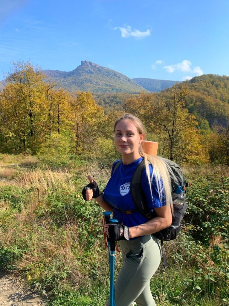 Woman hiking outdoors during a break from dating apps